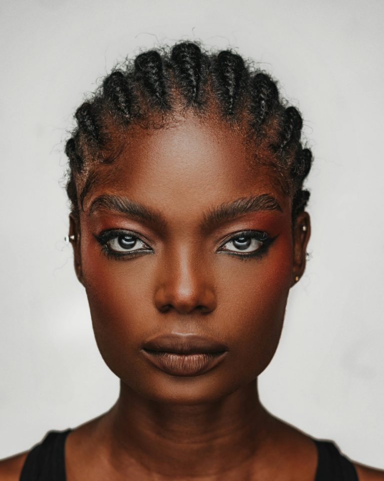 Image of a black woman with a full face of makeup