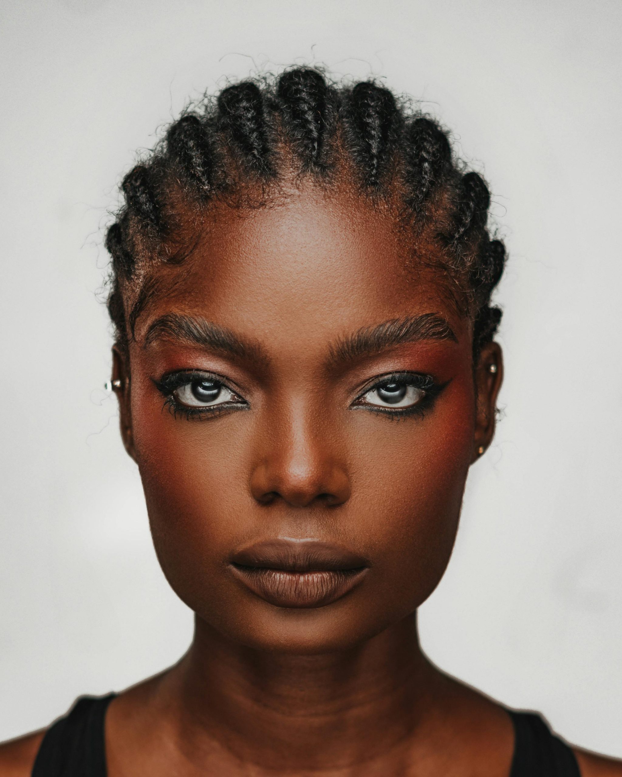 Image of a black woman with a full face of makeup