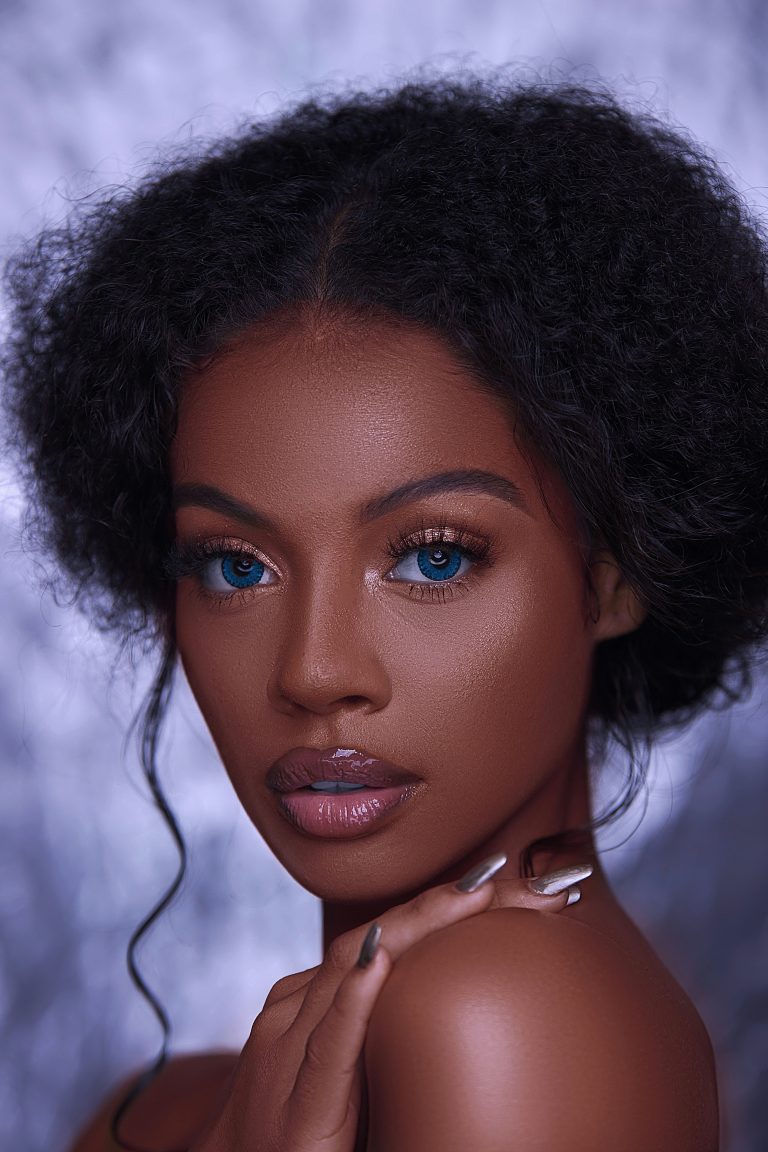 A black girl with doll like makeup